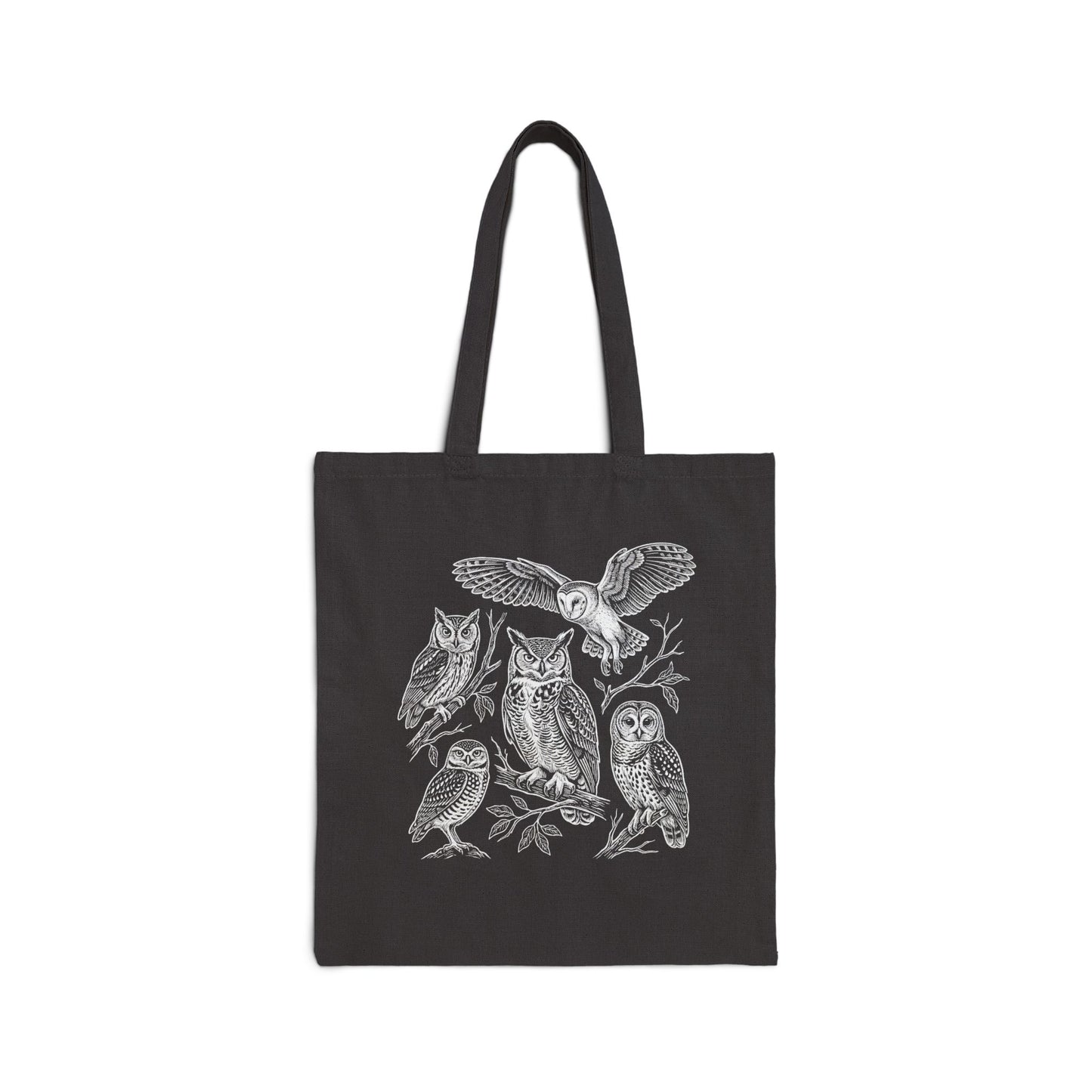 A black canvas tote bag with two shoulder straps, featuring a detailed white line art illustration of five owls perched on branches on the front, set against a plain white background.