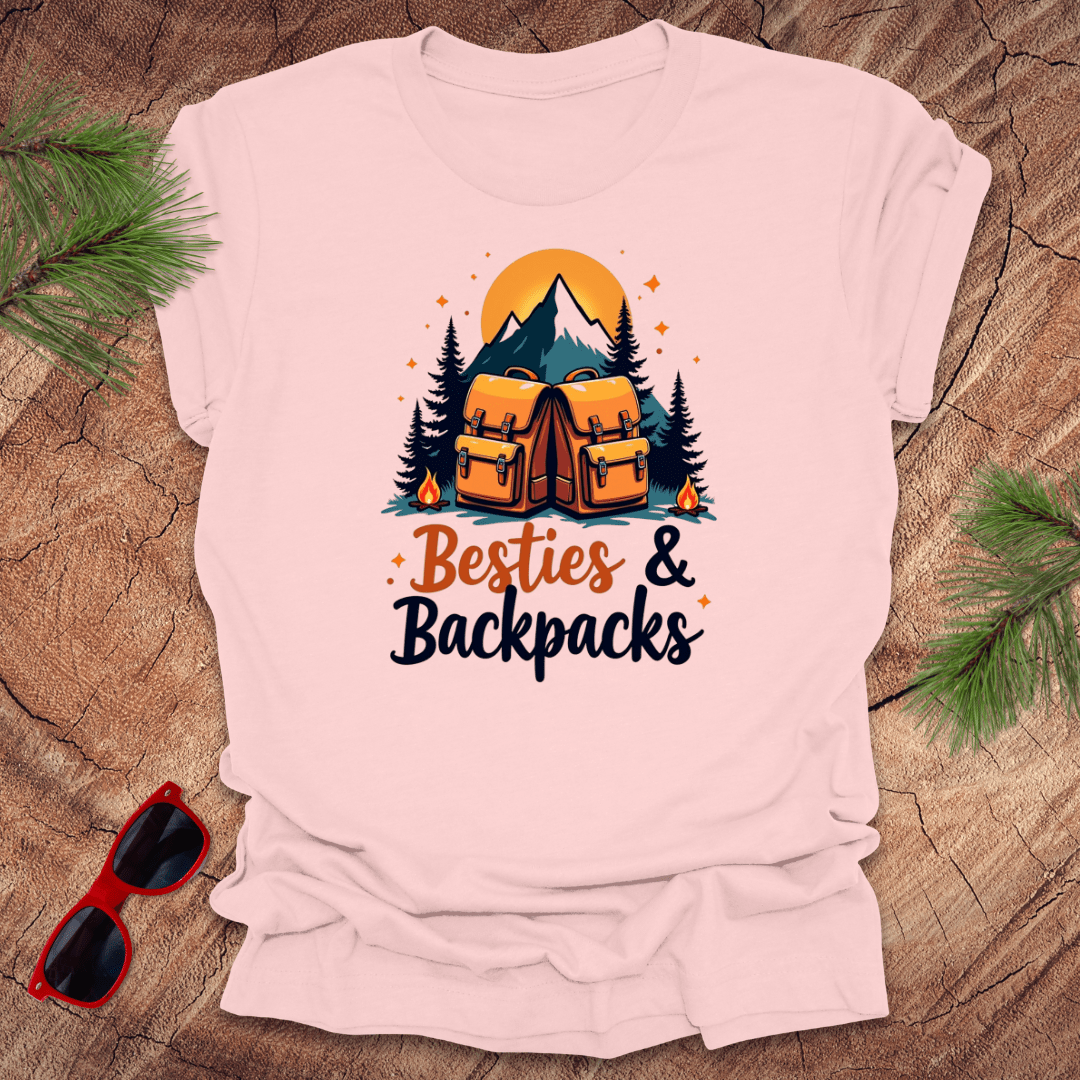 pink tshirt with 2 backpacks and text 'besties & backpacks' on a wood background