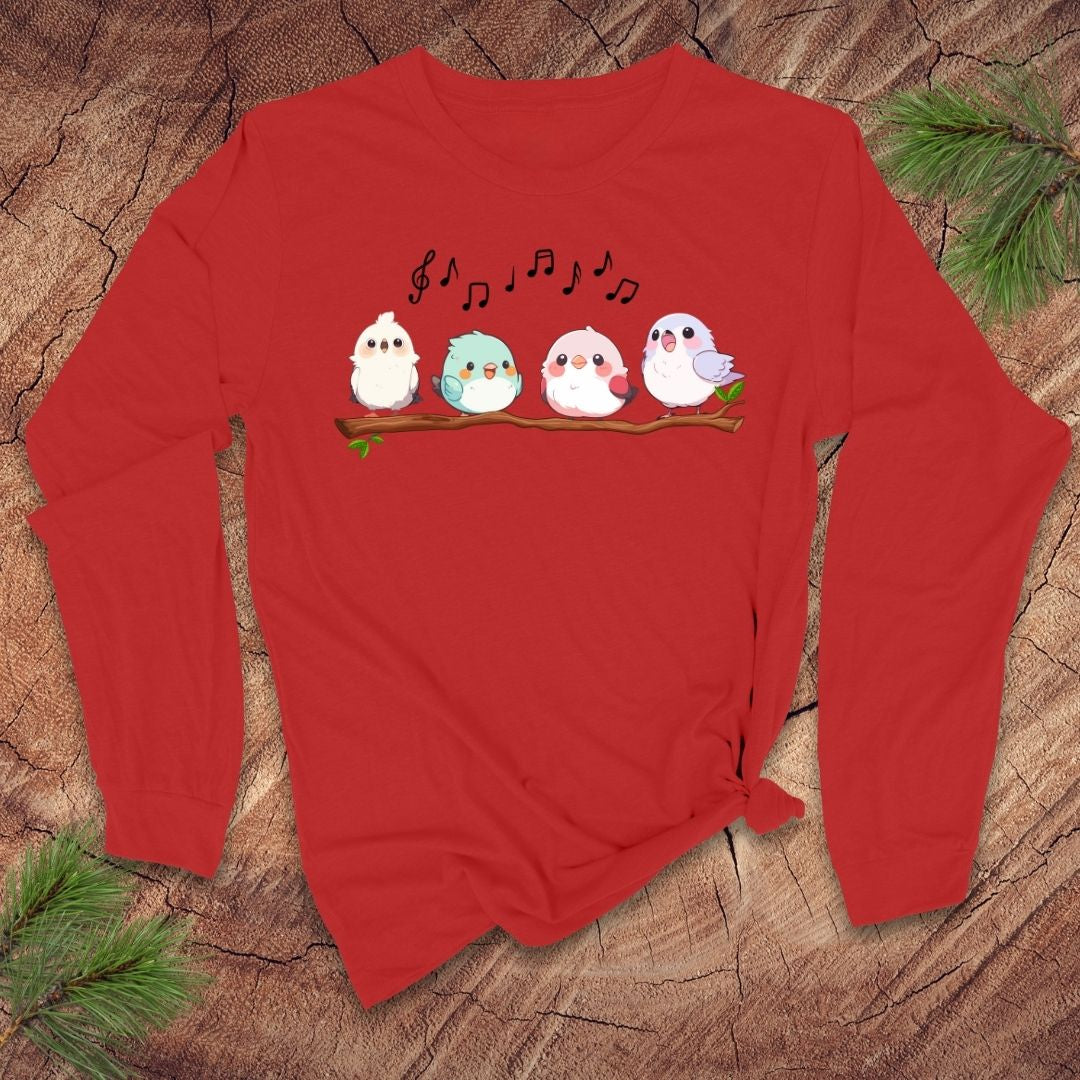 Red long sleeve t-shirt with four cartoon birds on a branch with musical notes over them, on a wooden background.
