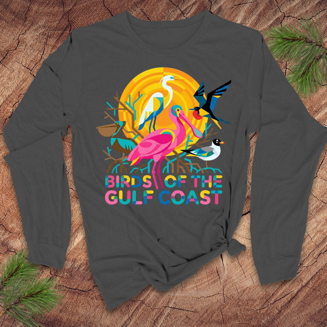 Gray long-sleeve tshirt with colorful 'Birds of the Gulf Coast' design on a wooden surface