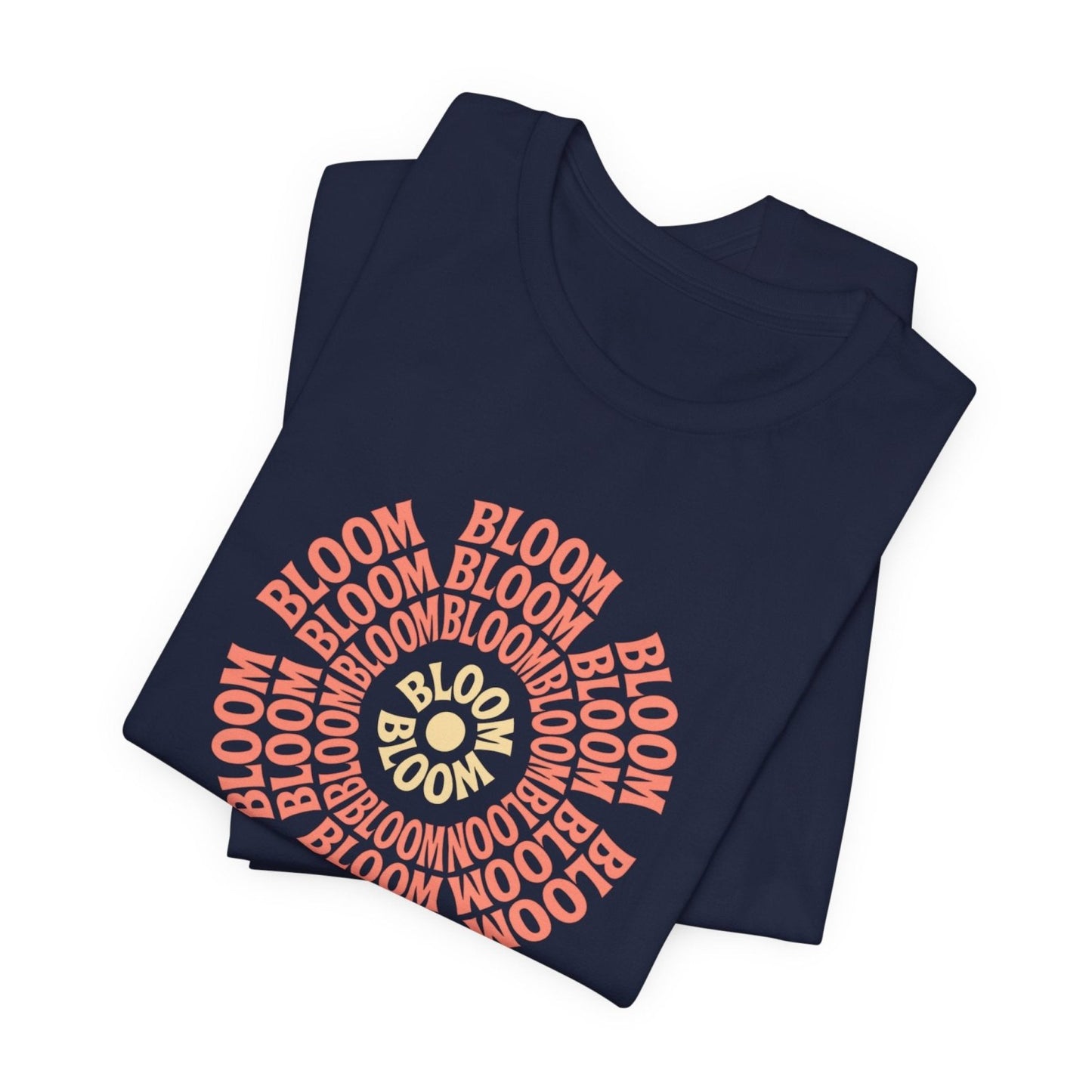 Navy blue folded t-shirt with 'BLOOM' printed in red and gold on a white background