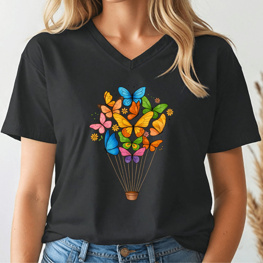 Black t-shirt with colorful butterfly design worn by a person