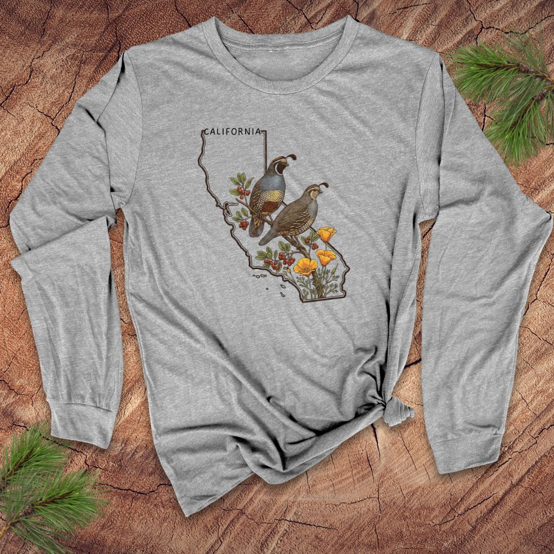 Grey long-sleeve shirt with California map and quail and poppies design on a wooden surface