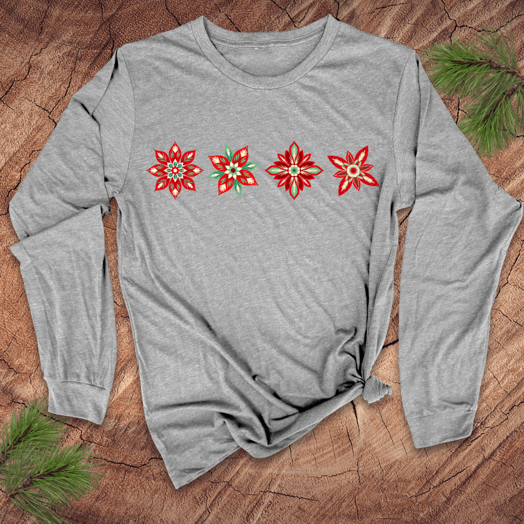 Gray long-sleeve shirt with red poinsettia designs on a wooden surface