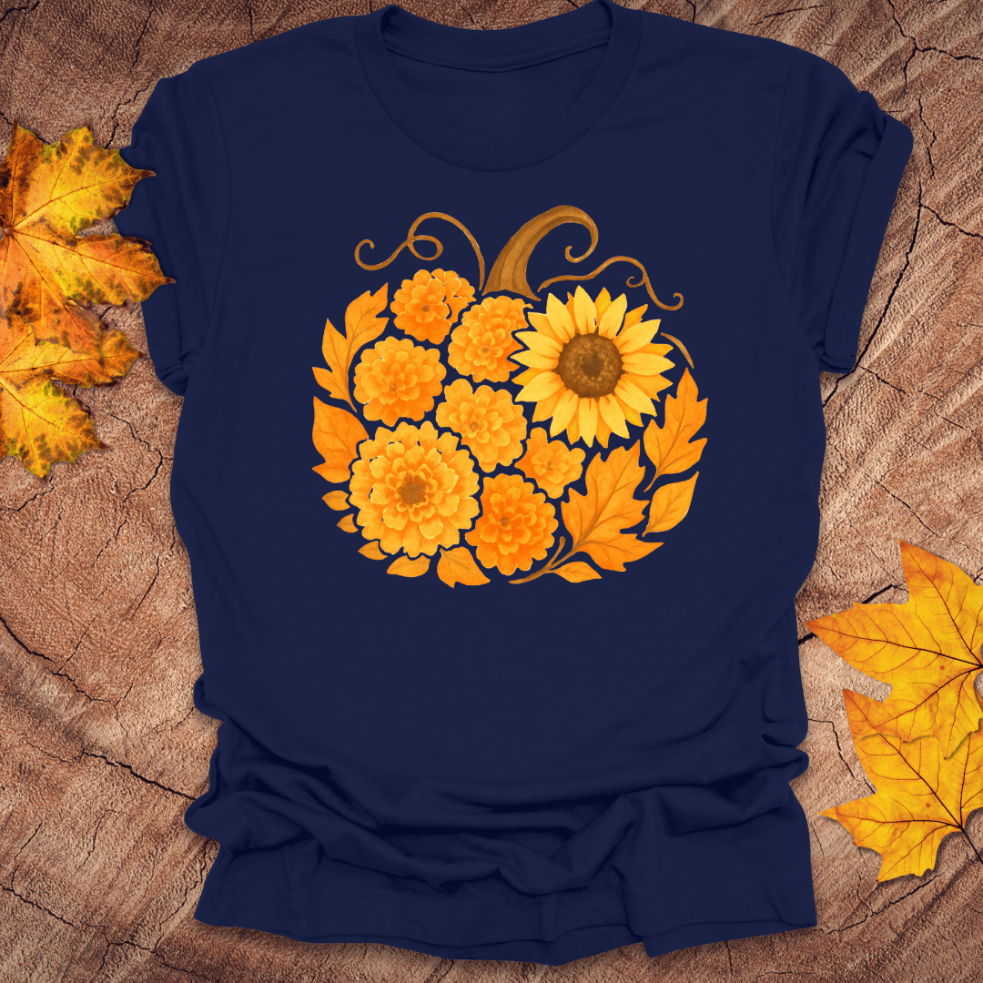 Navy blue t-shirt with a sunflower design on a wooden surface with autumn leaves.