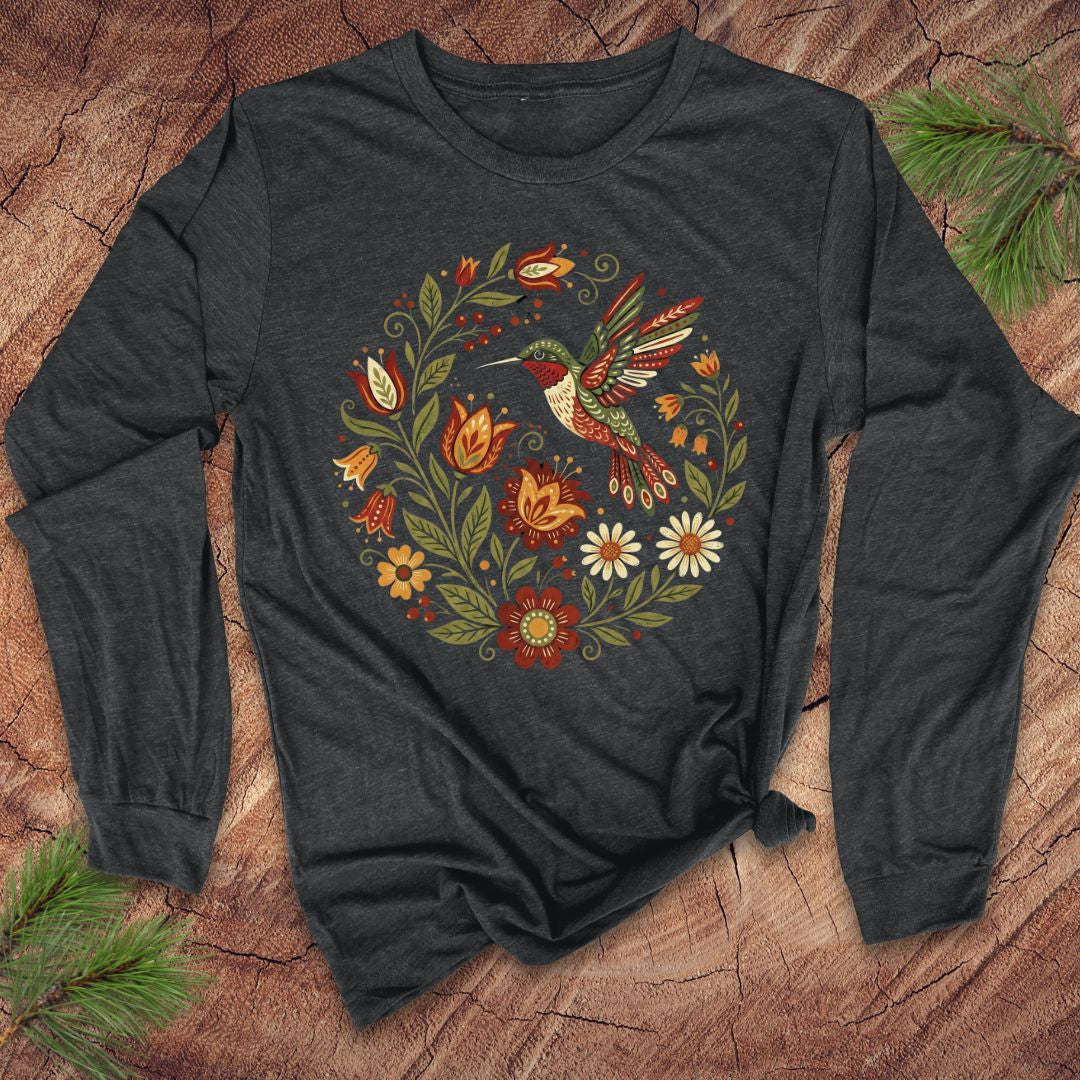 Dark gray long-sleeve shirt with a colorful hummingbird and floral design on a wooden surface.