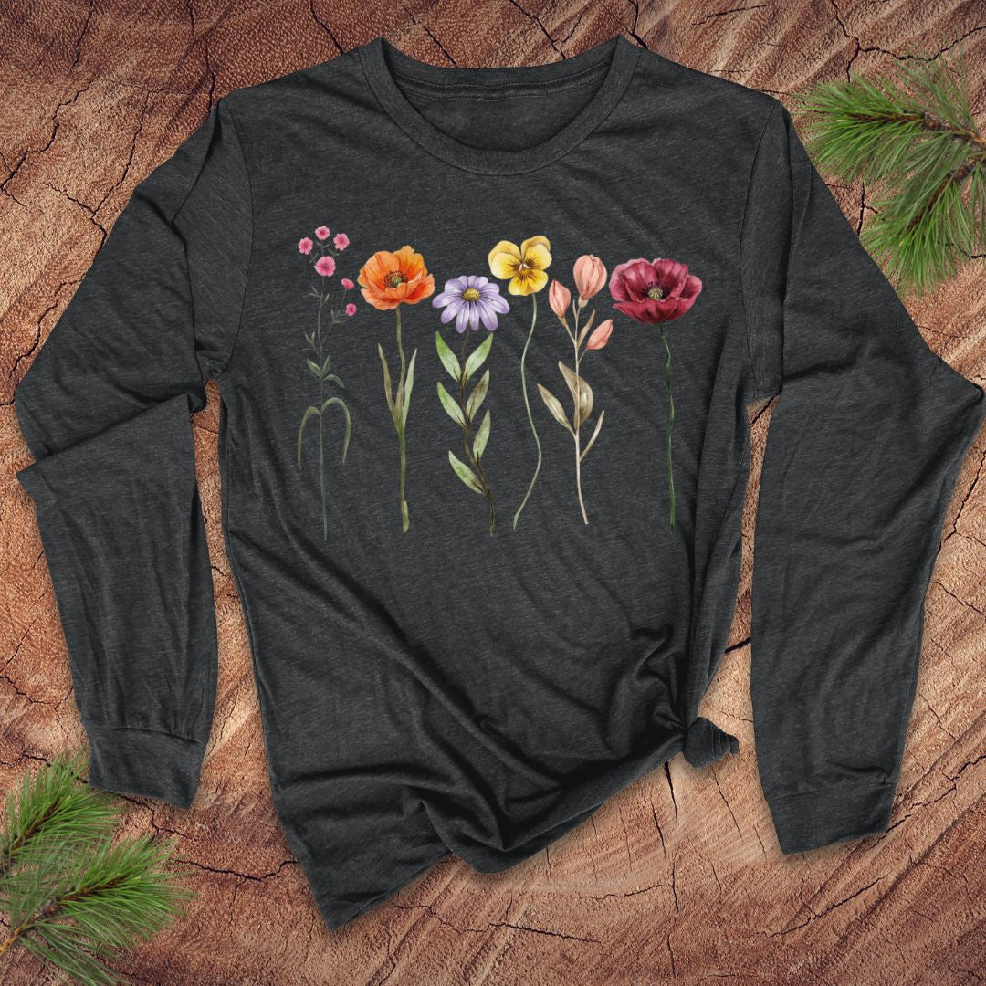 Dark gray long-sleeve shirt with floral design on a wooden surface