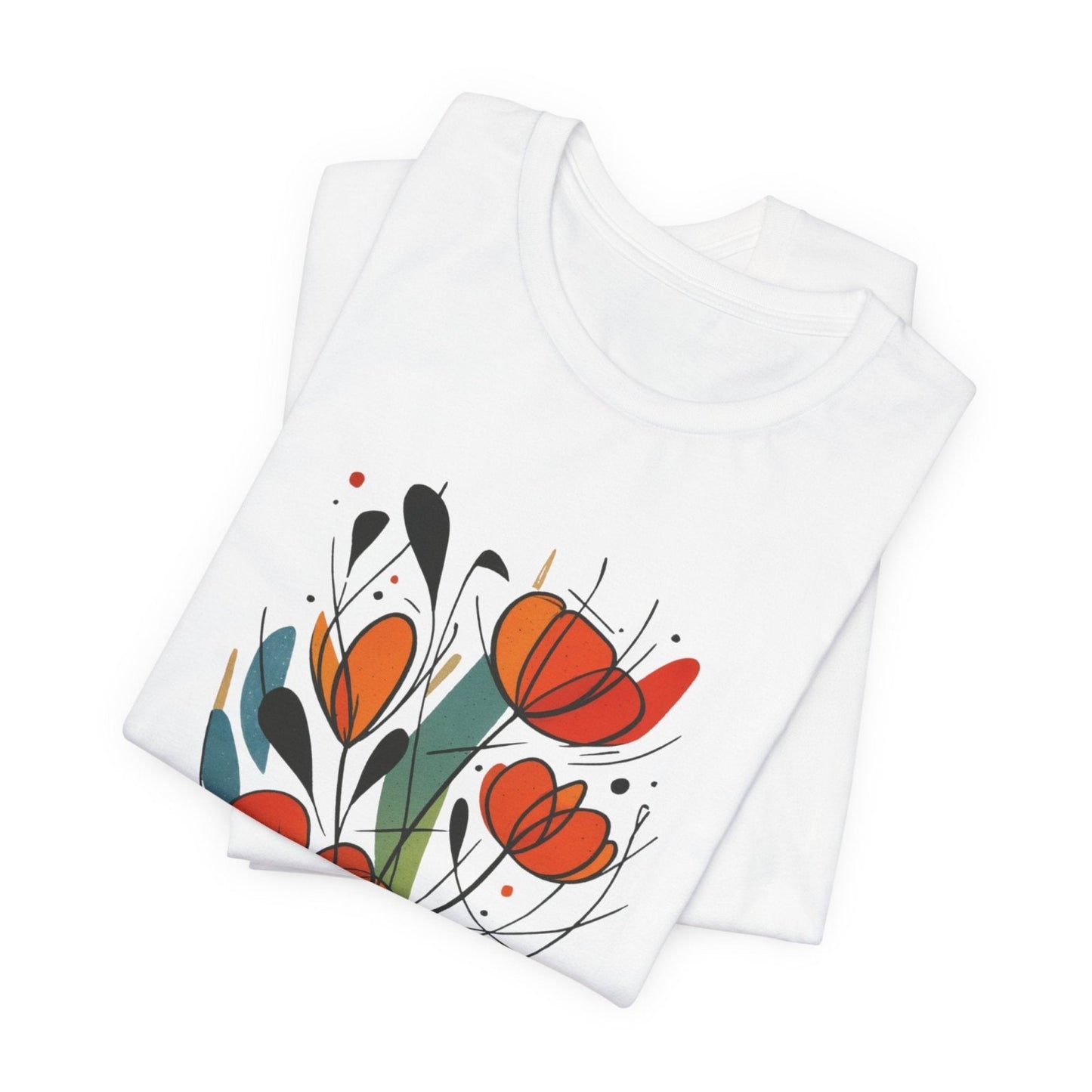 White folded tshirt with colorful floral designs on a white background