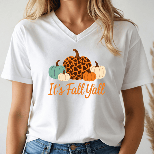 White t-shirt with pumpkins and 'It's Fall Yall' text worn by a person