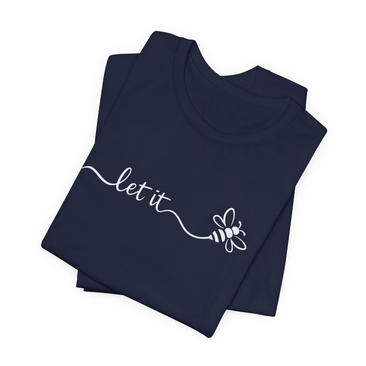 Navy blue folded t-shirt with 'let it' and bee design on a white background