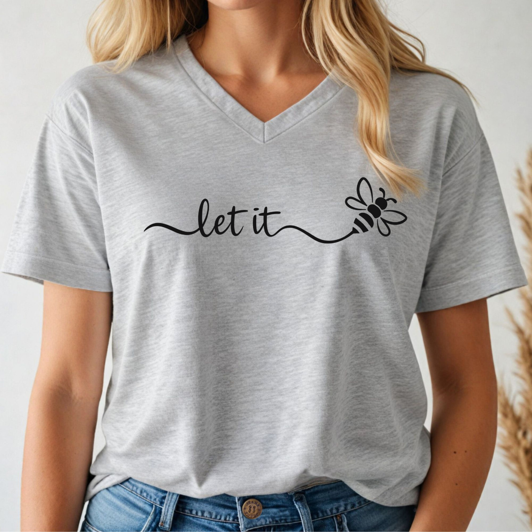 Grey v-neck t-shirt with 'let it' and bee design worn by a person