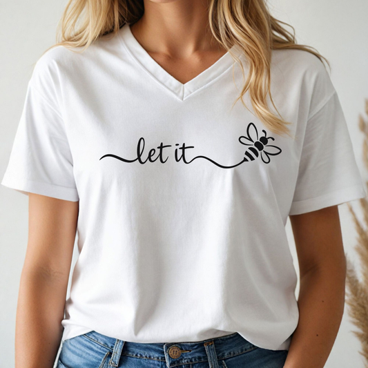 White v-neck t-shirt with 'let it' and bee design worn by a person