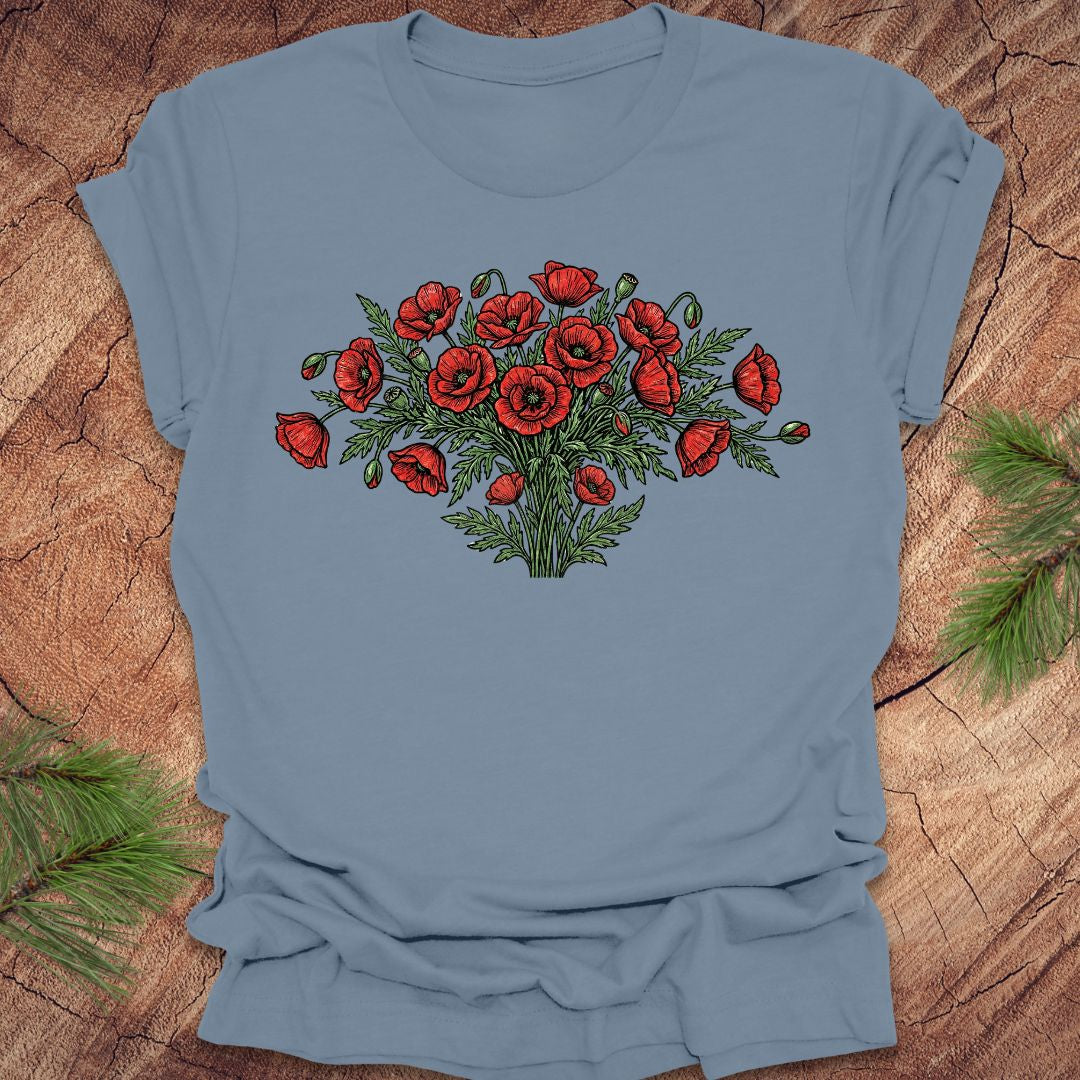 Steel blue t-shirt with red poppy bouquet design on a wooden surface