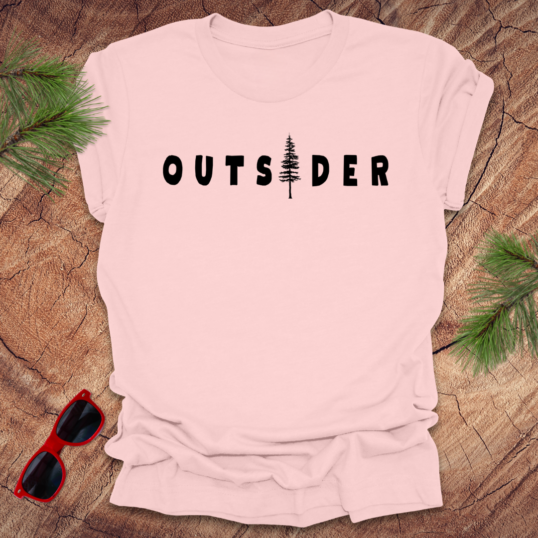 Flat lay of soft pink Outsider t-shirt by Wandering Owl Adventure Co.