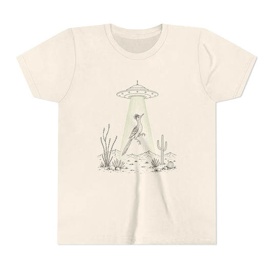 An off-white crewneck t-shirt featuring a minimalist graphic of a bird perched under a UFO with a green beam shining down on a desert landscape with cacti.