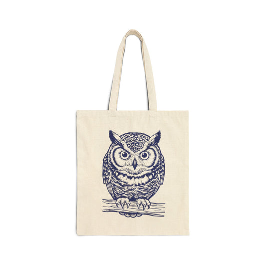 Tote bag with a linocut owl design on a white background