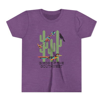 Purple t-shirt with a graphic design of cacti and birds on a white background