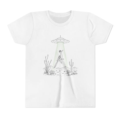 A white short-sleeve crewneck t-shirt featuring a black and white line art graphic of a bird under a UFO with a greenish light beam in a desert setting.