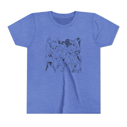 A heather blue short-sleeve crewneck t-shirt featuring a black line art graphic of various cartoon penguins on the front chest, displayed against a solid white background.