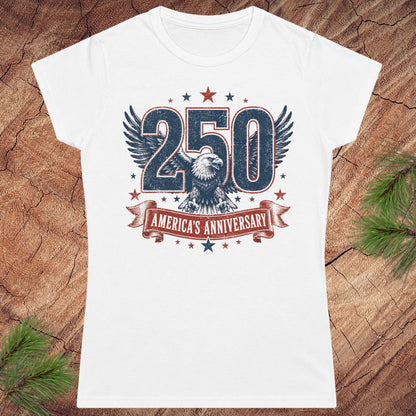 White t-shirt with '250 America's Anniversary' design on a wooden surface