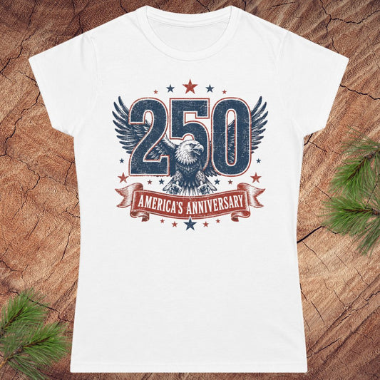 White t-shirt with '250 America's Anniversary' design on a wooden surface