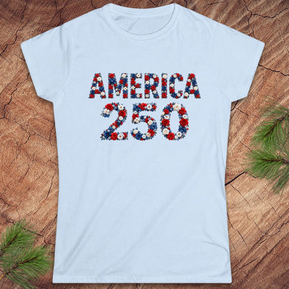 Light blue t-shirt with 'AMERICA 250' design on a wooden surface