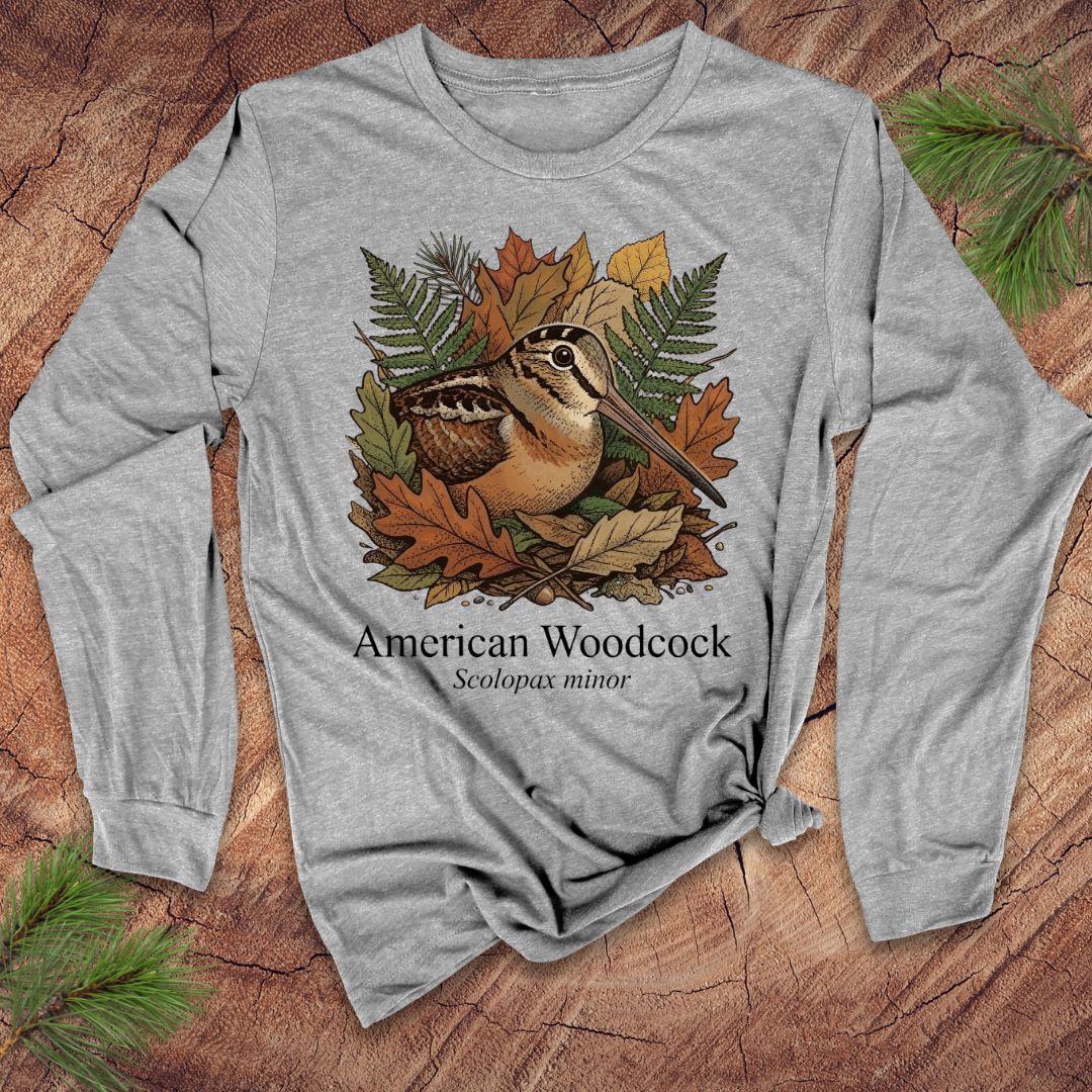 Gray long-sleeve shirt with American Woodcock design on a wooden surface