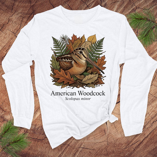 White long-sleeve shirt with American Woodcock design on a wooden surface