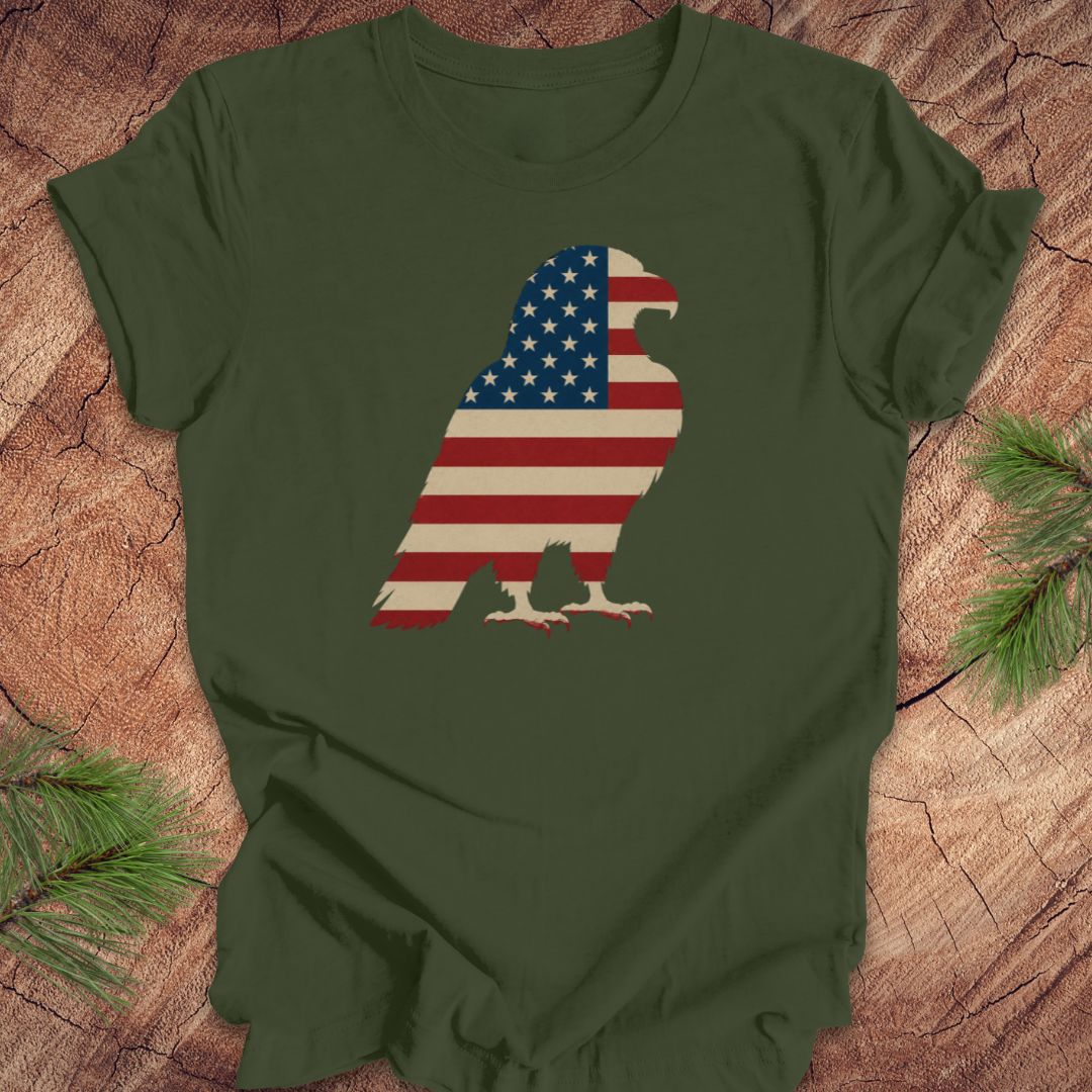 Green t-shirt with American flag eagle design on a wooden surface