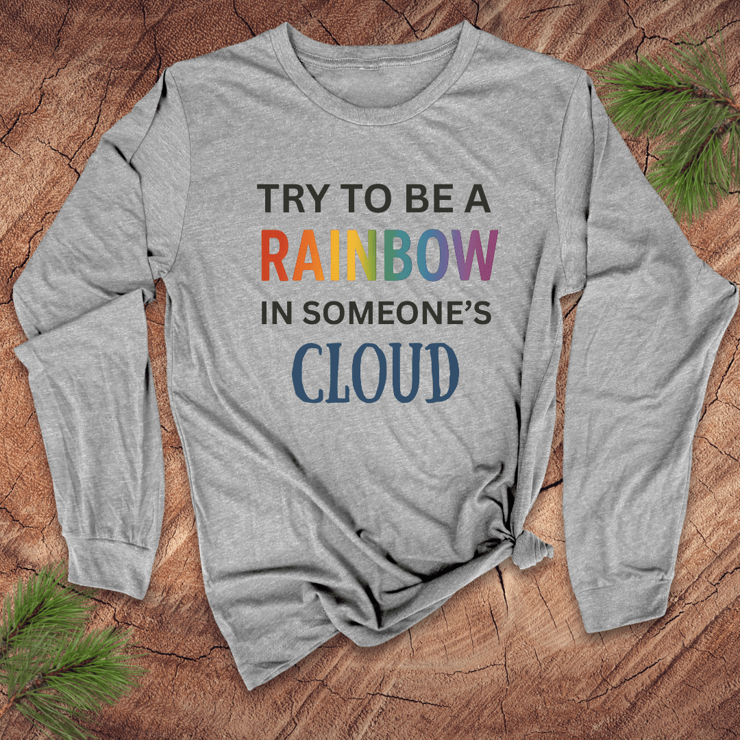 Gray long-sleeve shirt with motivational quote on a wooden surface