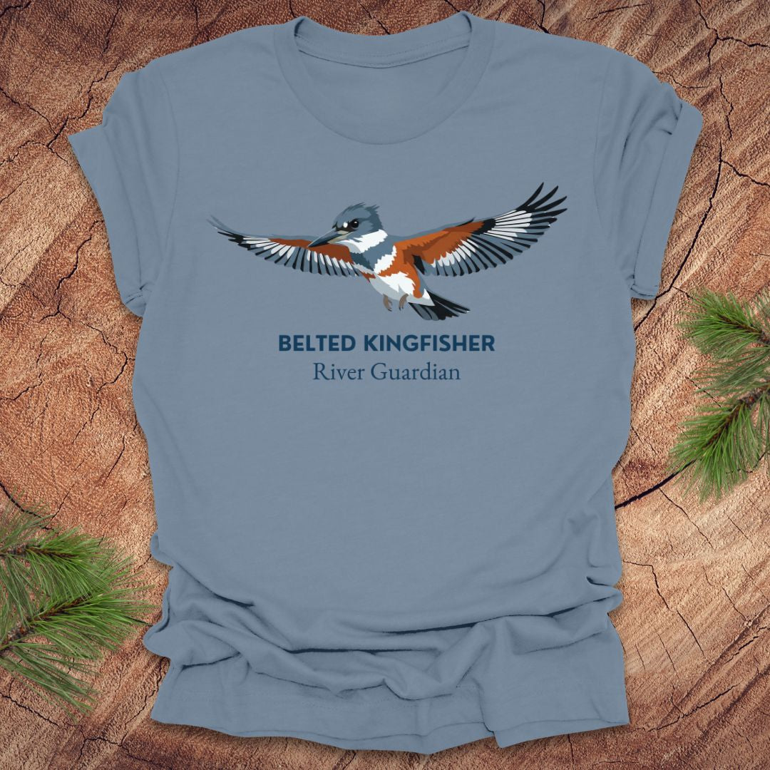 Steel blue t-shirt with belted kingfisher design and text, 'belted kingfisher river guardian' on a wooden surface