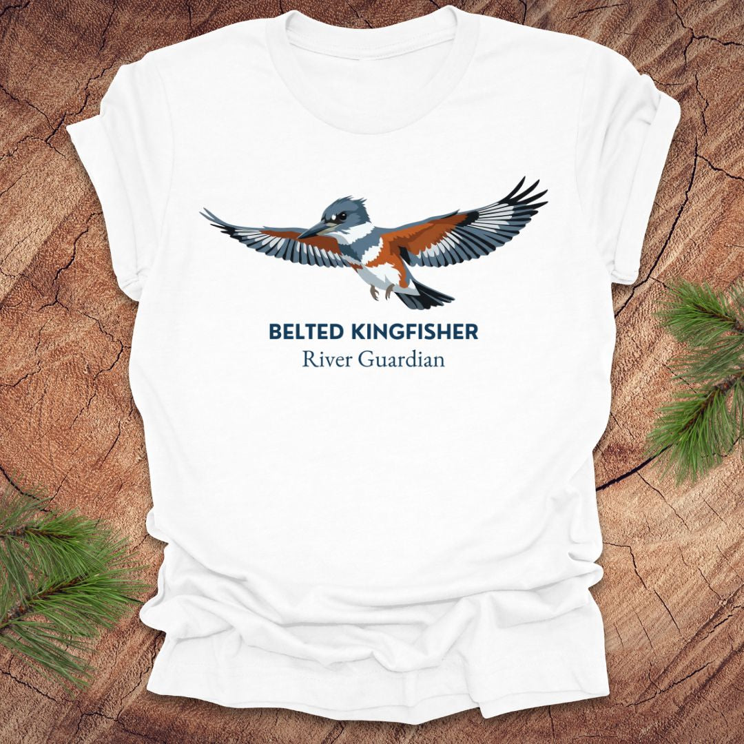 White t-shirt with belted kingfisher design and text, 'belted kingfisher river guardian' on a wooden surface