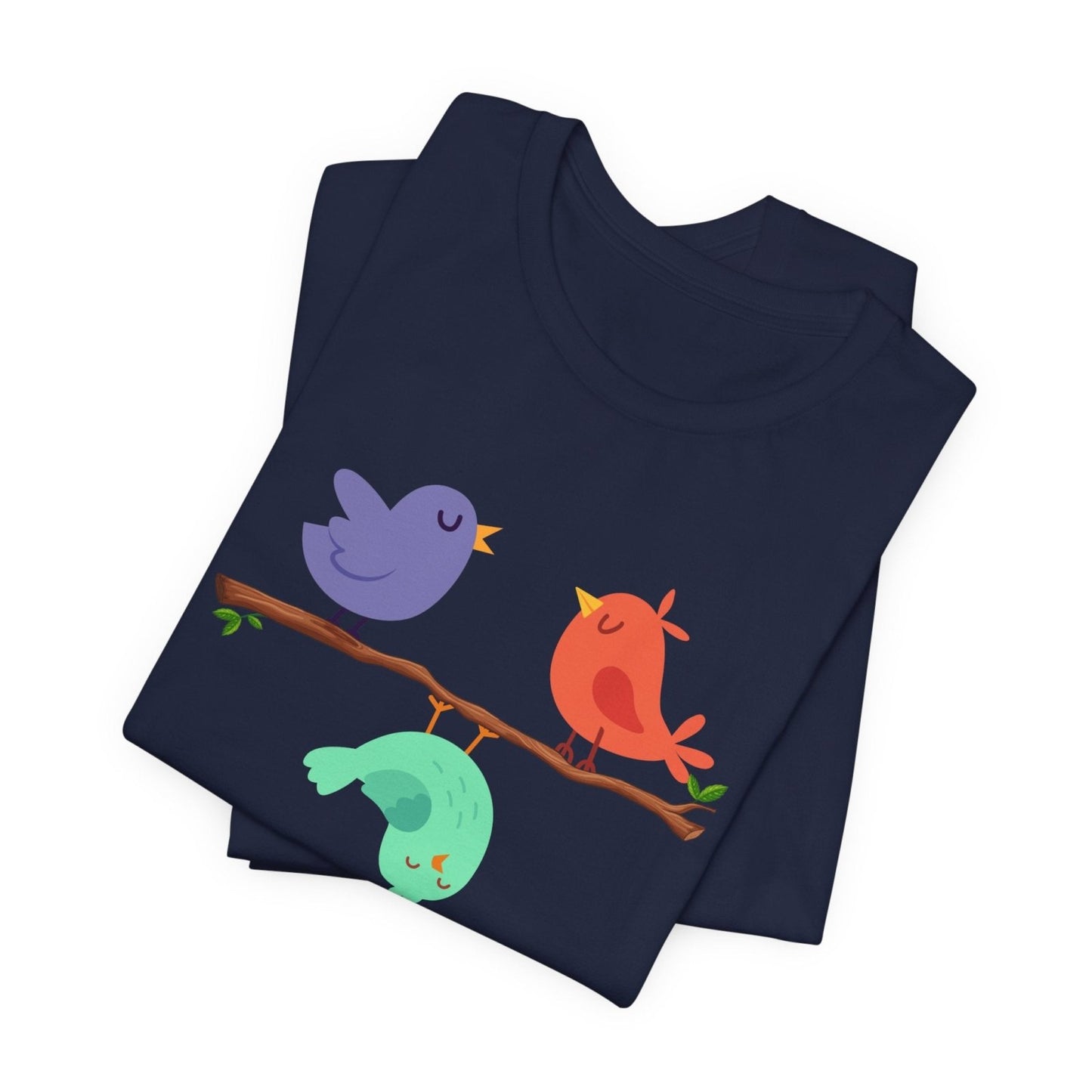 Navy blue folded t-shirt with colorful birds design on a white background