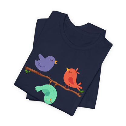 Navy blue folded t-shirt with colorful birds design on a white background