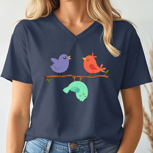 Navy blue t-shirt with colorful birds design worn by a person