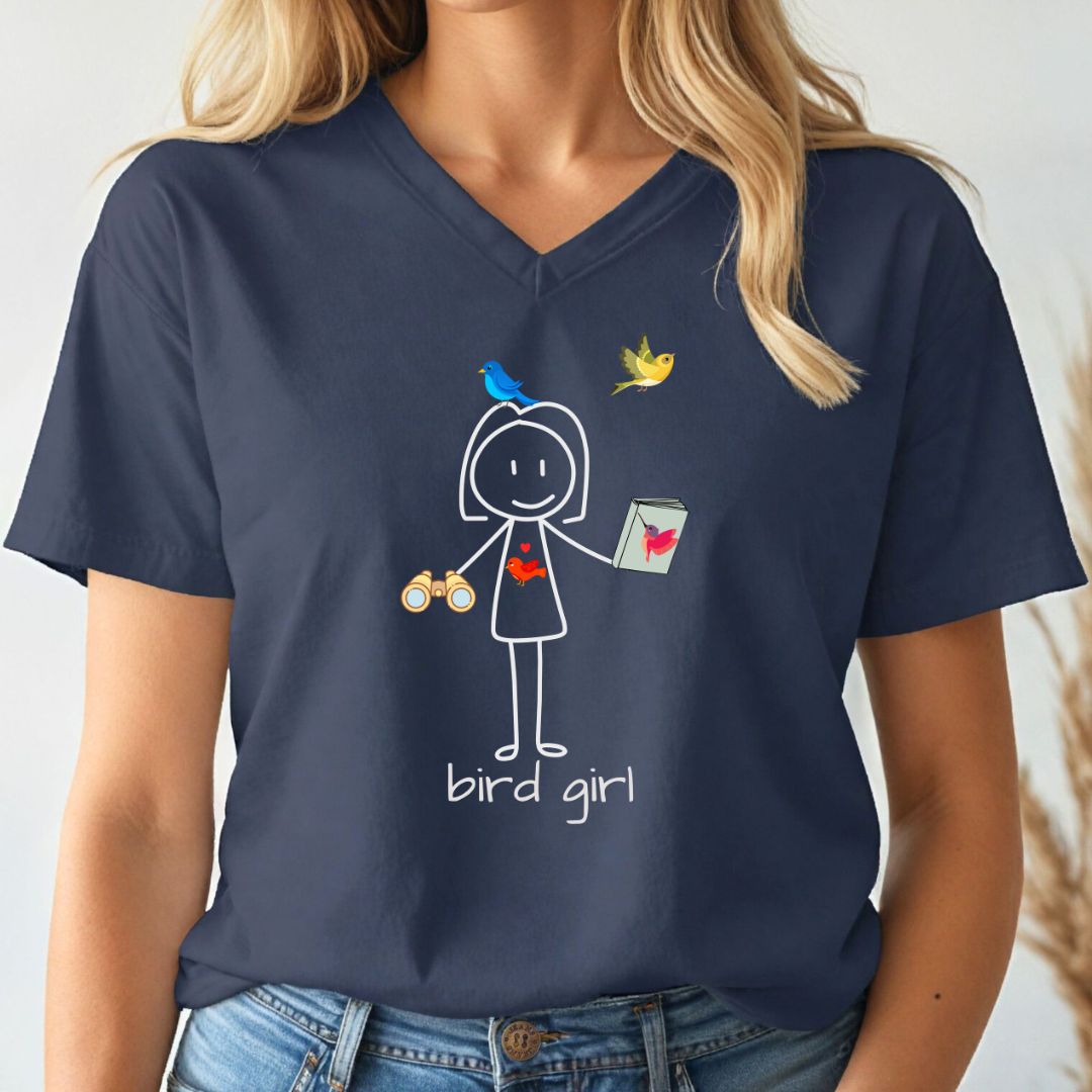 Navy blue t-shirt with a graphic design of a stick figure holding birds and a can, labeled 'bird girl', worn by a person.