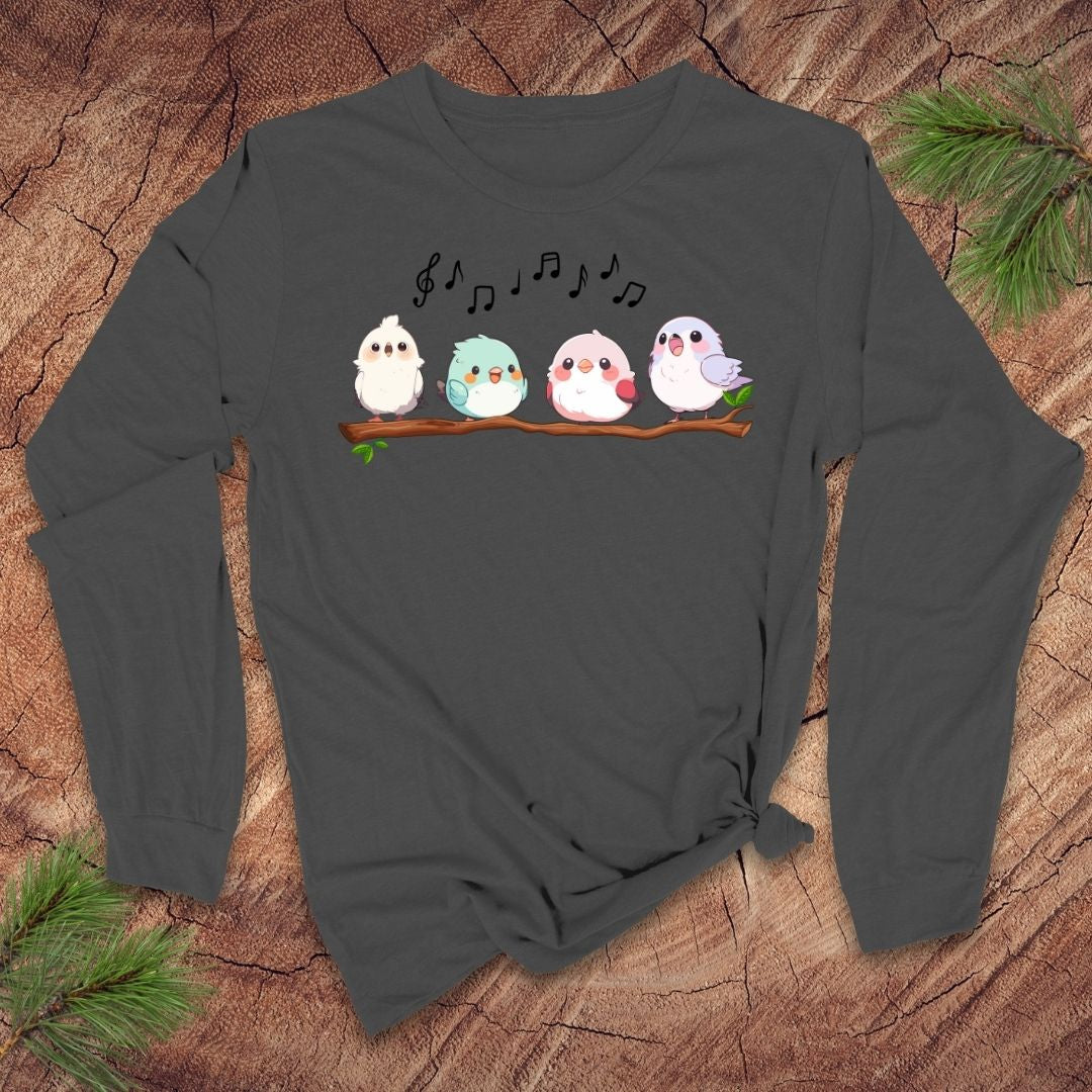 Dark gray long sleeve t-shirt with four cartoon birds on a branch with musical notes over them, on a wooden background.