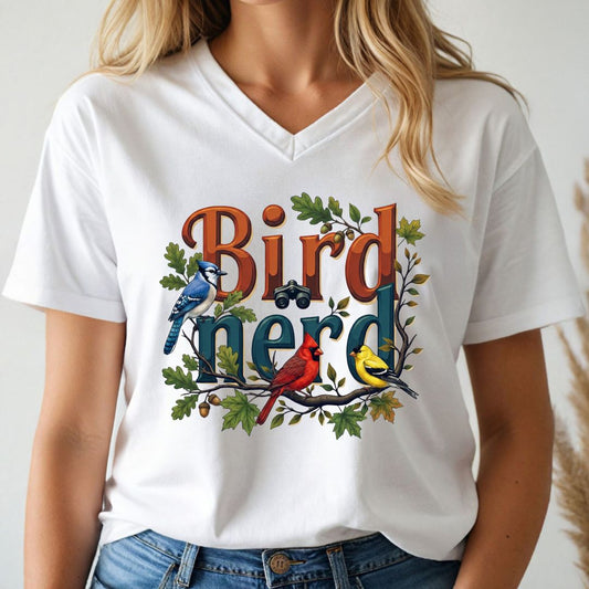 Person wearing a white t-shirt with 'Bird Nerd' design featuring birds and foliage.