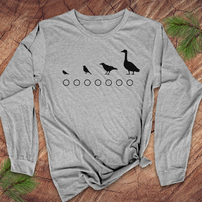 Gray long-sleeve shirt with bird and goose design on a wooden surface