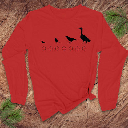 Red long-sleeve shirt with black bird illustrations on a wooden surface