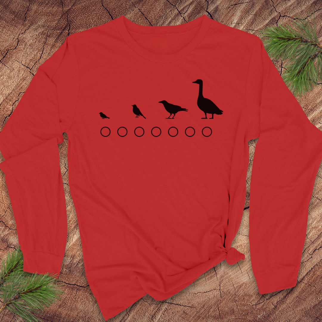 Red long-sleeve shirt with black bird illustrations on a wooden surface