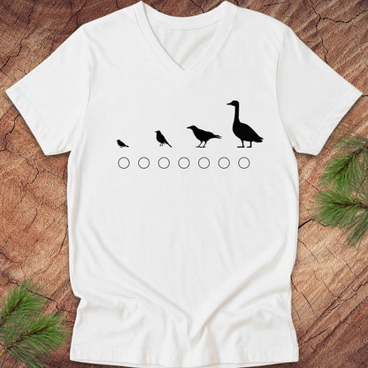 White v-neck t-shirt with black bird illustrations on a wooden surface