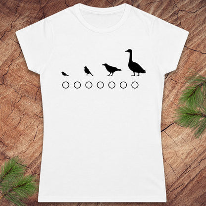 White t-shirt with black bird illustrations on a wooden surface