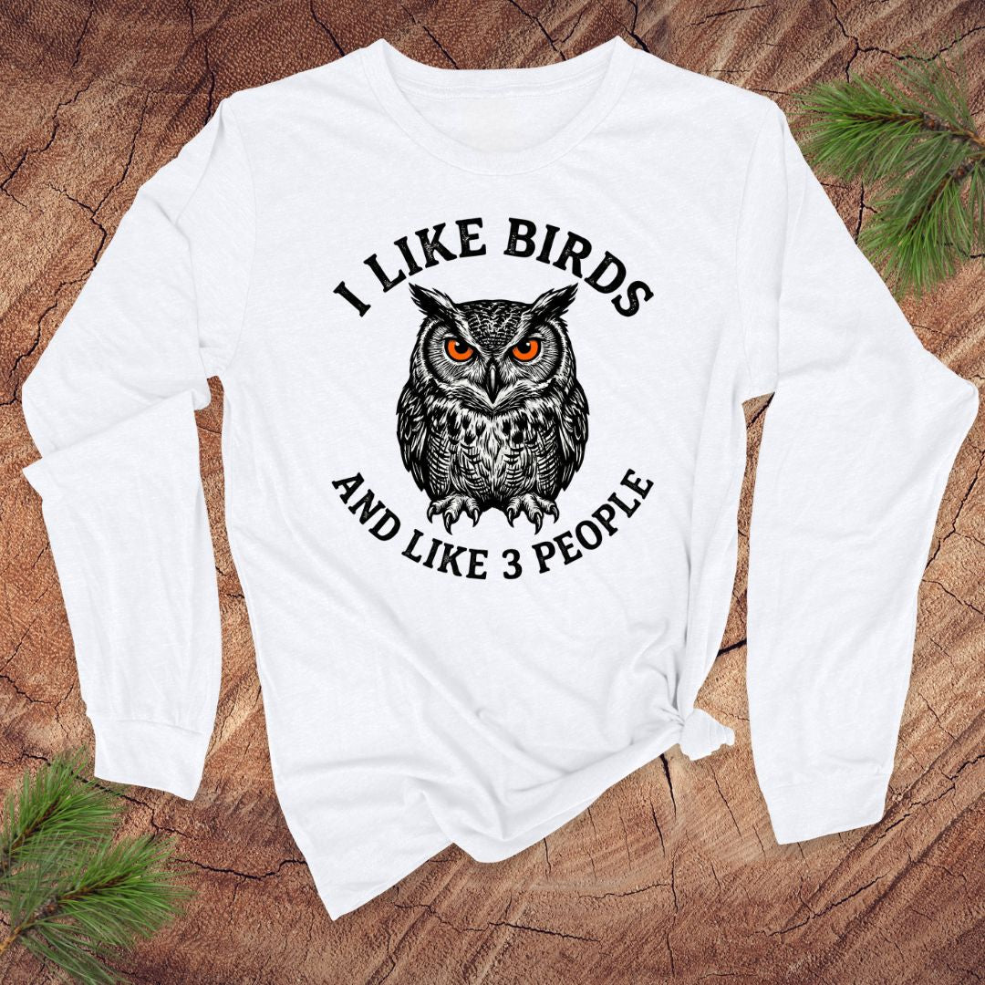 White long-sleeve shirt with an owl graphic and text ' i like birds and like 3 people' on a white background