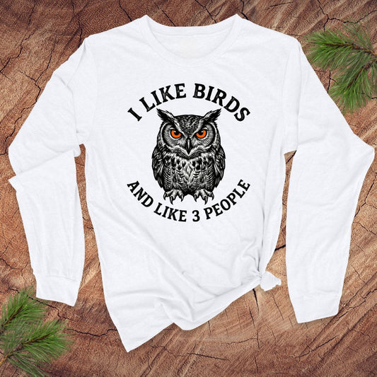White long-sleeve shirt with an owl graphic and text ' i like birds and like 3 people' on a white background