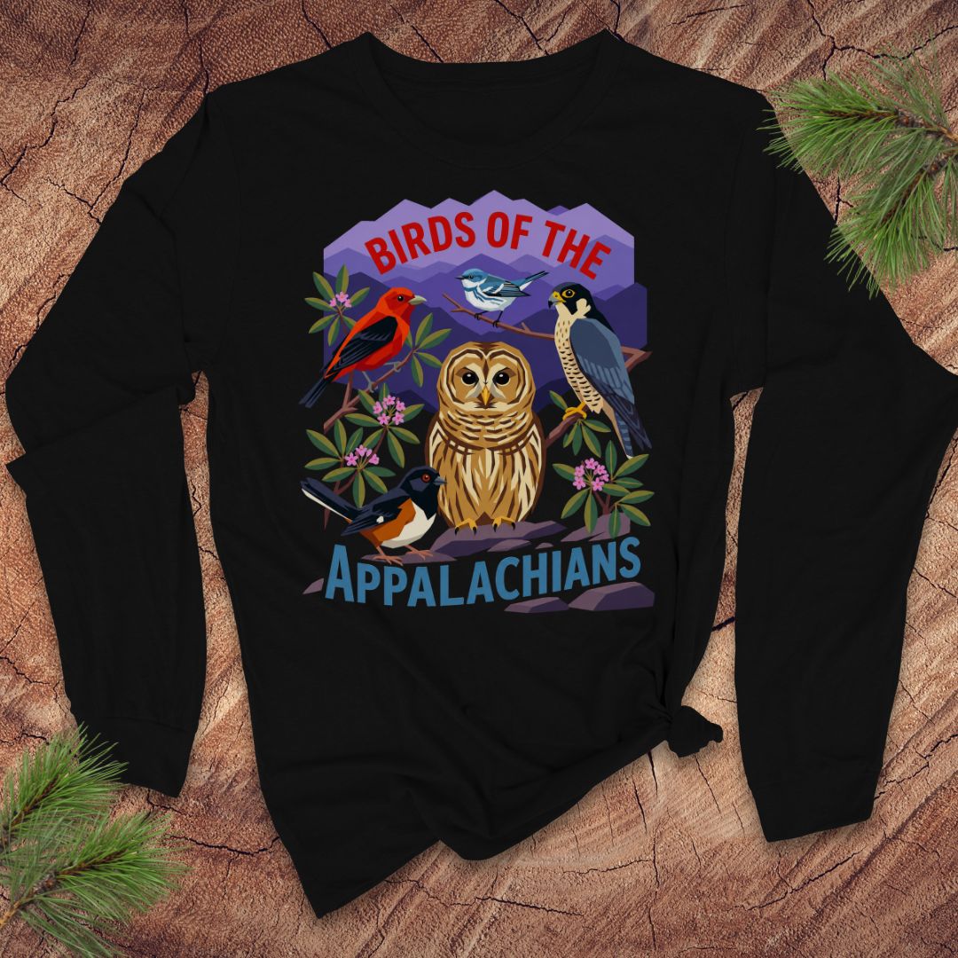 Black long-sleeve tshirt with birds and mountains and text, 'birds of the appalachians' on a wood background