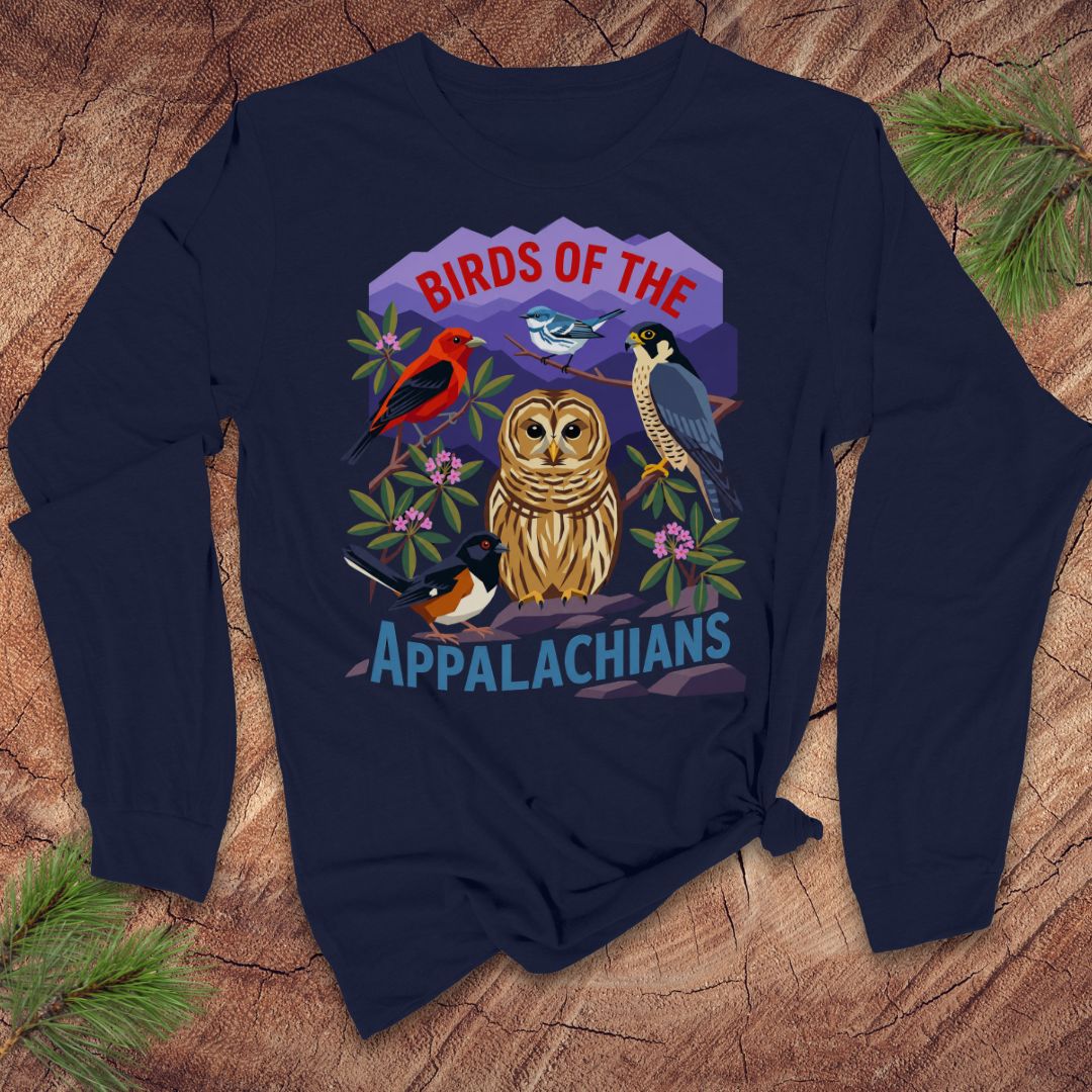 Navy blue long-sleeve tshirt with birds and mountains and text, 'birds of the appalachians' on a wood background