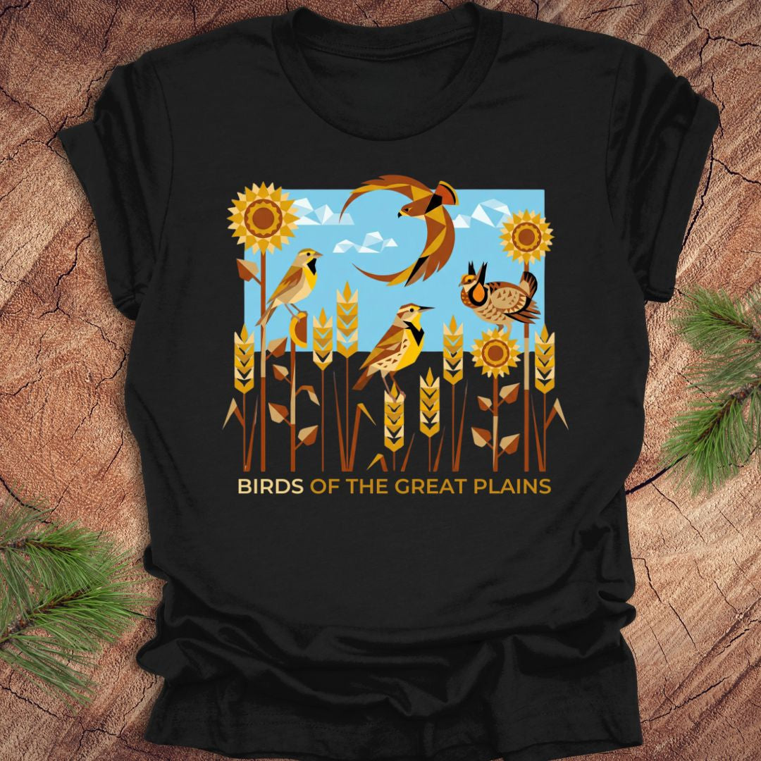 Black t-shirt with 'Birds of the Great Plains' design featuring birds, sunflowers, and a moon on a wooden surface.