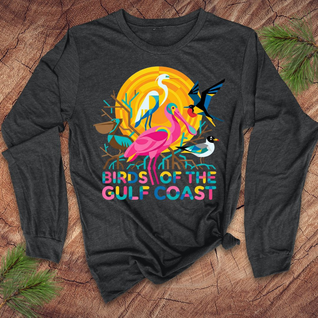 Dark gray long-sleeve shirt with colorful 'Birds of the Gulf Coast' design on a wooden surface.
