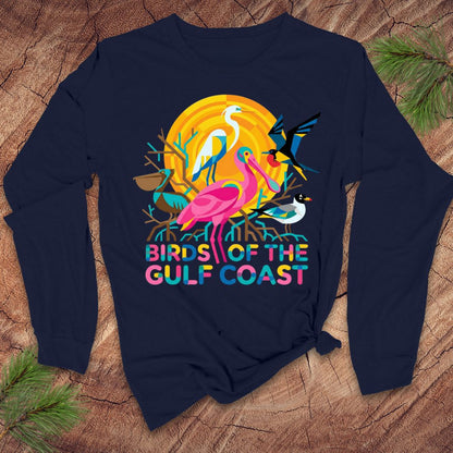 Navy blue long-sleee tshirt with colorful 'Birds of the Gulf Coast' design on a wooden surface.